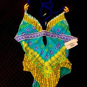 Trina Turk one piece. Size 4. Open back, accent ties, gold hardware.
